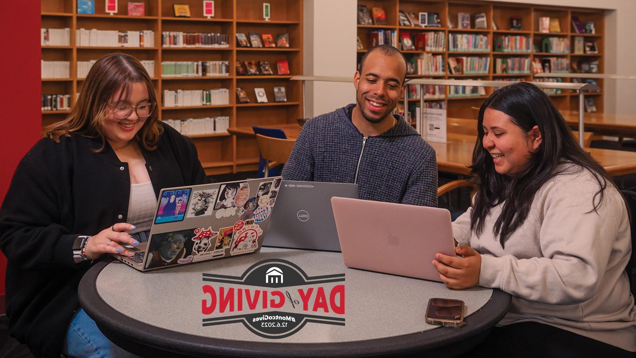 Students working on laptops in library and Day of Giving logo